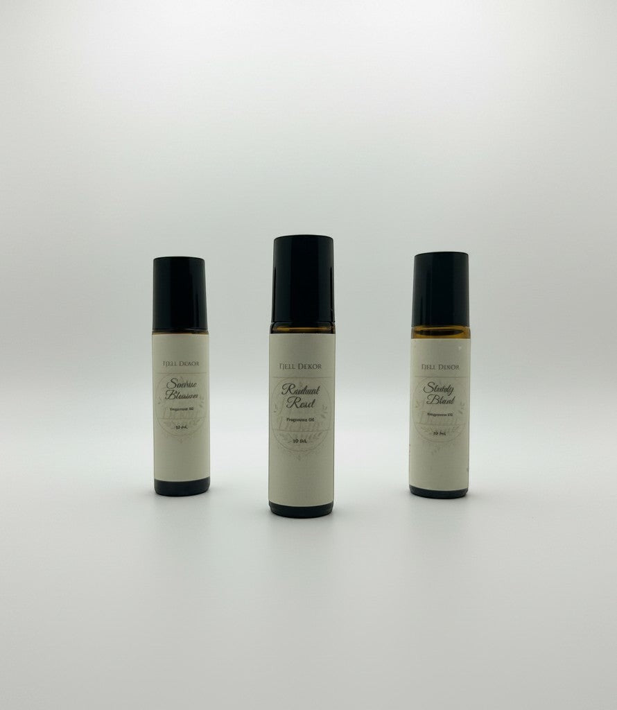 Fjell Dekor aromatherapy roll-on trio featuring Radiant Reset, Sunrise Blossom, and Sturdy Blend 10mL glass bottles.