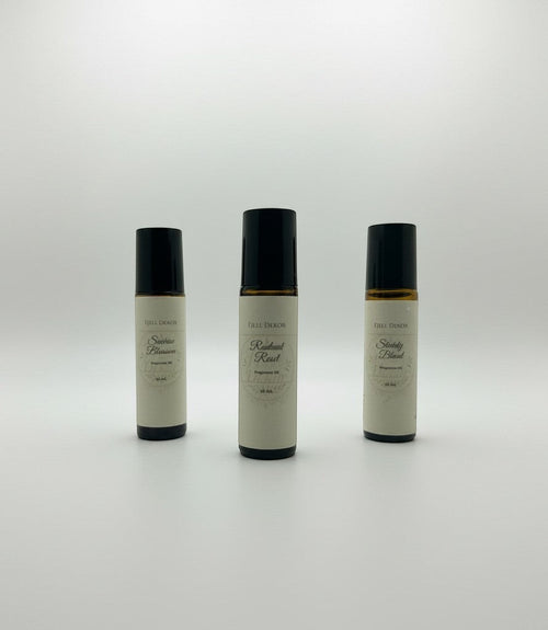 Fjell Dekor aromatherapy roll-on trio featuring Radiant Reset, Sunrise Blossom, and Sturdy Blend 10mL glass bottles.
