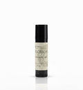 Fjell Dekor Blossom Kiss 5.5g natural hydrating lip balm in a black tube with a botanical label.