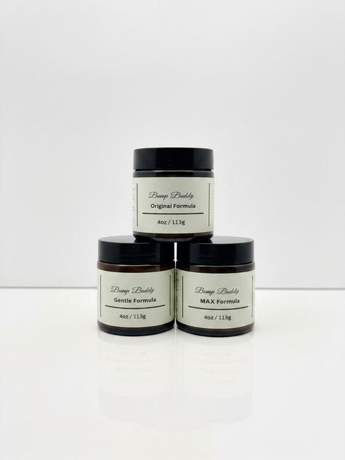 Fjell Dekor Bump Buddy 4oz balm jars in Gentle, Original, and Max formulas stacked on a white surface.