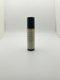 Fjell Dekor Devotion 10ml botanical body fragrance roller in an amber glass bottle with a minimalist label.