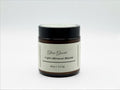 Fjell Dekor Glow Guard 4oz balm in an amber glass jar with a black lid, featuring a minimalist label.