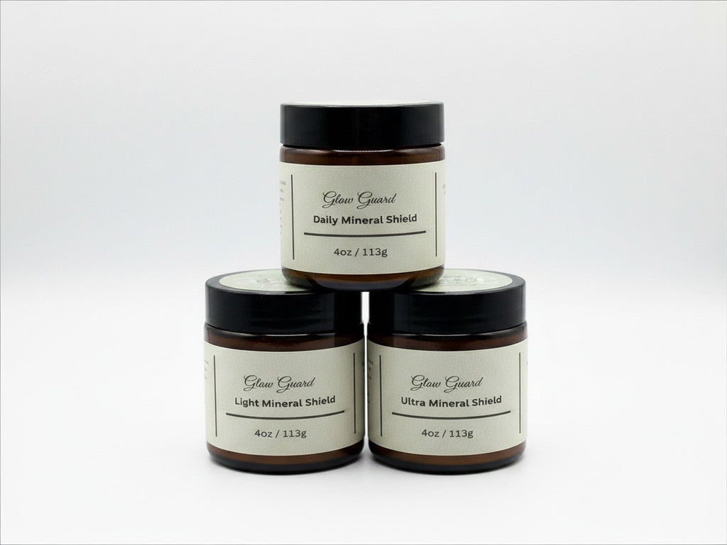 Fjell Dekor Glow Guard 4oz mineral shield balm jars stacked in a pyramid against a white background.
