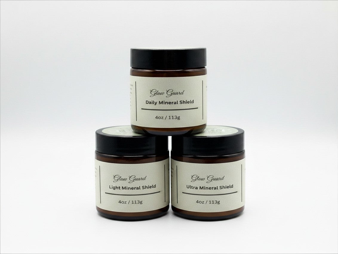 Fjell Dekor Glow Guard 4oz mineral shield balm jars stacked in a pyramid against a white background.