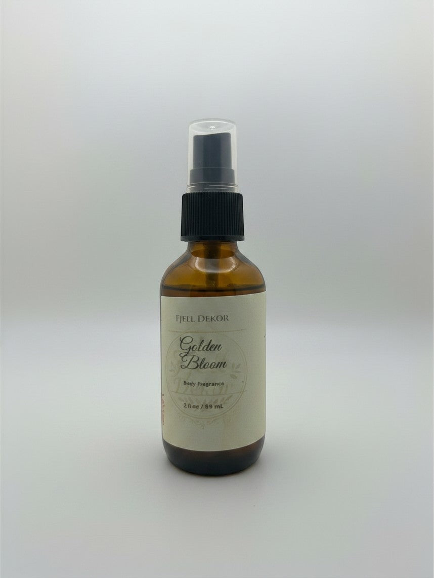 Fjell Dekor Golden Bloom 2oz body mist in an amber glass spray bottle with a minimalist botanical label