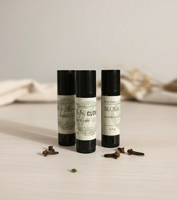 Fjell Dekor Kiss Collection variety pack of three natural lip balms with botanical ingredients on a neutral surface.