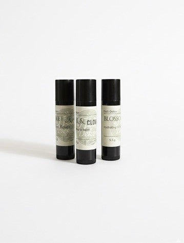 Fjell Dekor Kiss Collection variety pack featuring three natural beeswax lip balm tubes with minimalist labels.