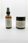 Fjell Dekor Nesting Bundle featuring a brown glass serum spray bottle and a matching moisture-lock elasticity balm jar