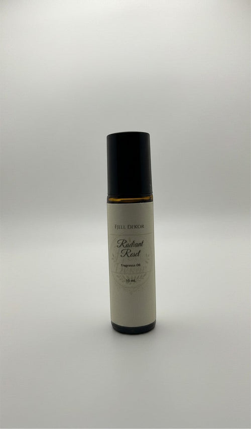 Fjell Dekor Radiant Reset aromatherapy roll-on bottle with amber glass, black cap, and minimalist label