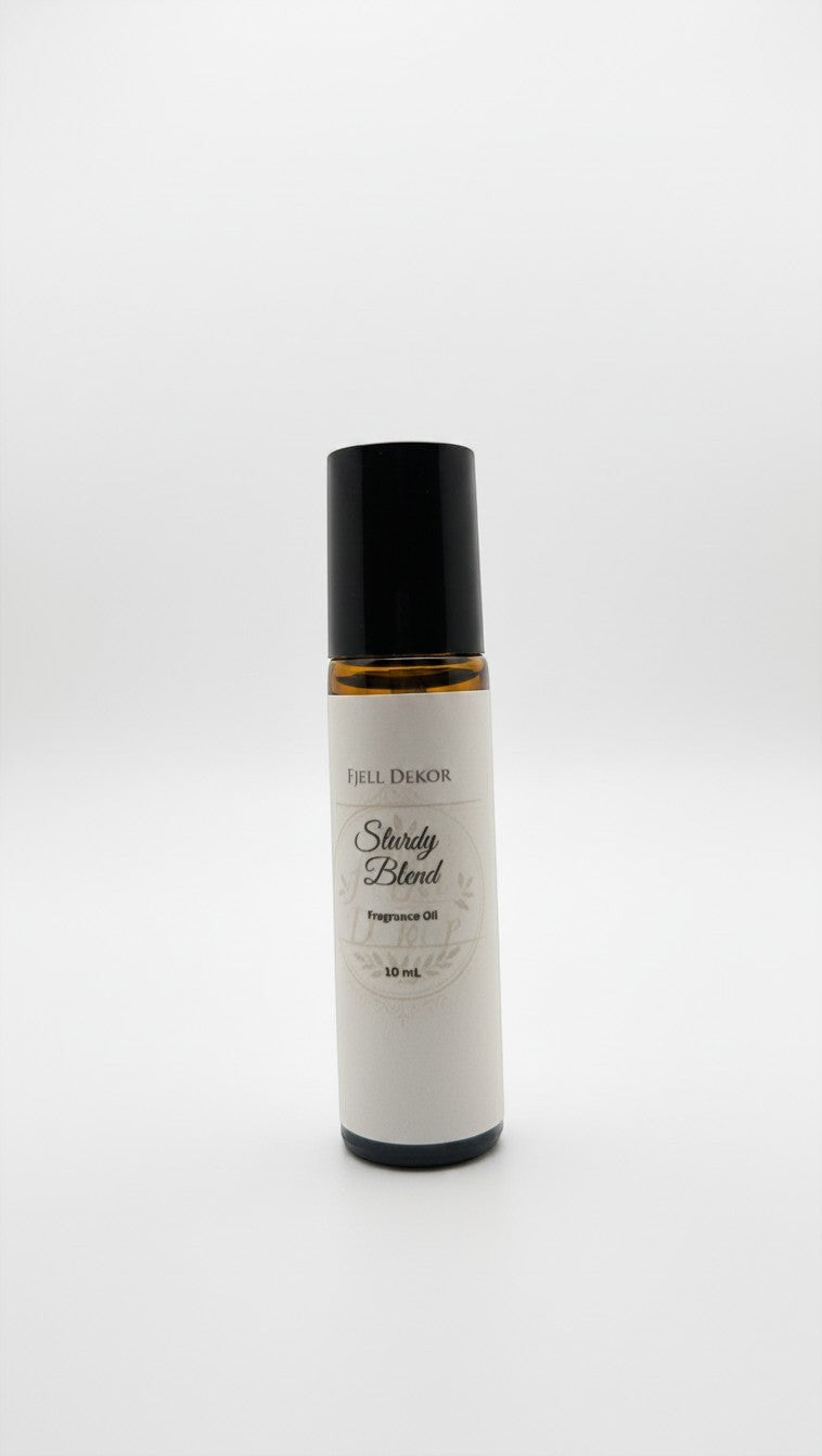 Fjell Dekor Sturdy Blend aromatherapy roll-on fragrance oil in a 10mL amber glass bottle with a black cap.