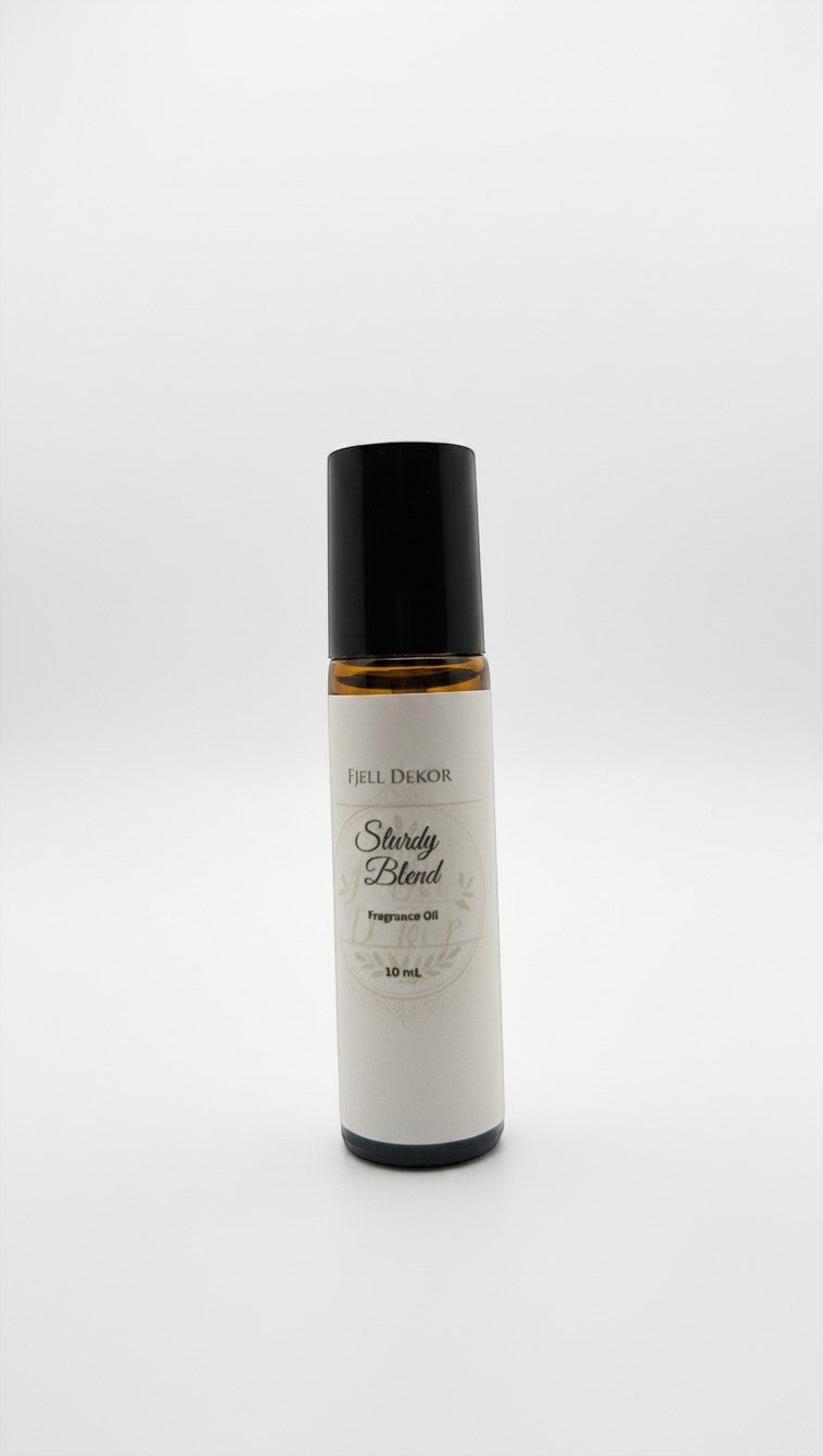 Fjell Dekor Sturdy Blend 10mL aromatherapy roll-on with woodsy citrus essential oils in an amber glass bottle.