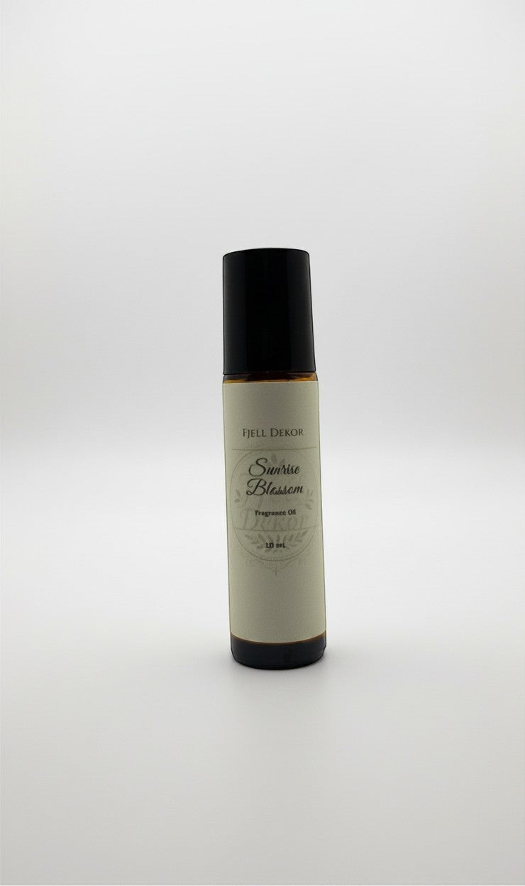 Fjell Dekor Sunrise Blossom aromatherapy roll-on bottle with essential oils for girls in a 10mL amber glass container.