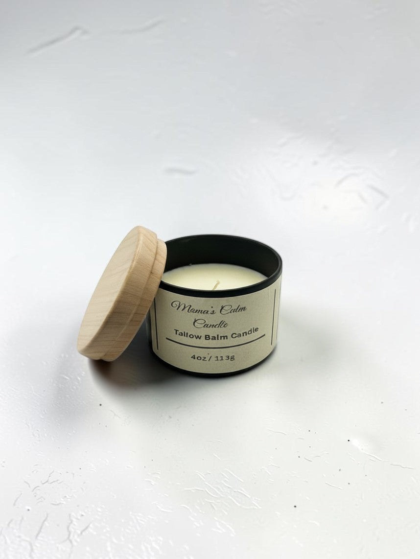 Fjell Dekor Mama’s Calm tallow balm candle in a black tin with a light wood lid on a white background