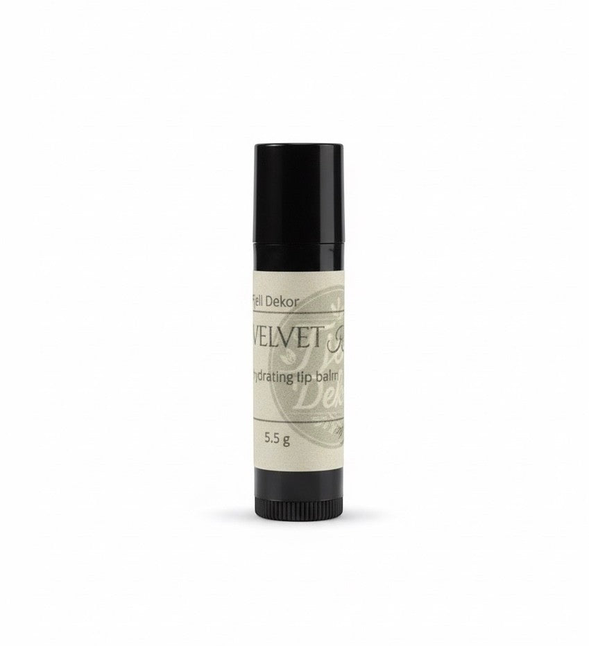 Fjell Dekor Velvet Kiss 5.5g natural lip balm in a black twist-up tube with a cream-colored label.