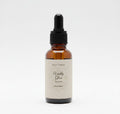 Fjell Dekor Vitality Gloss 1oz hair serum in an amber glass dropper bottle for scalp health and frizz control.